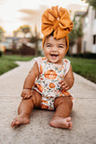 Floral pumpkin ruffle romper